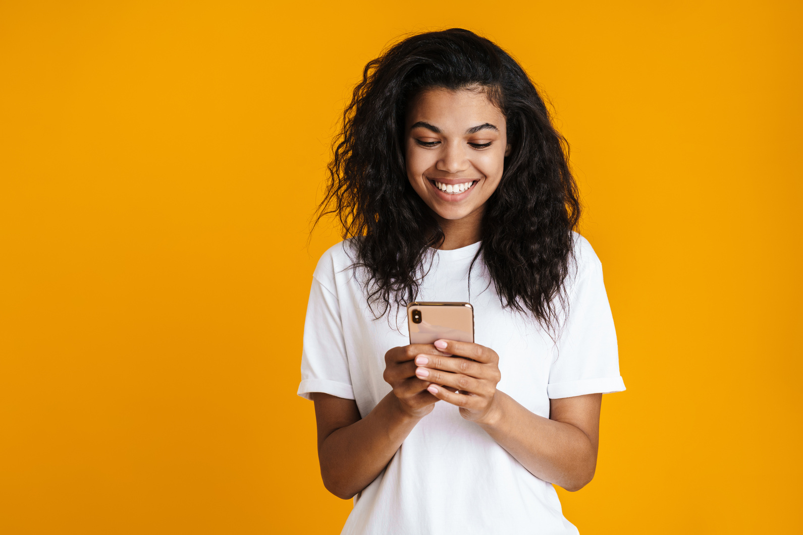 Smiling African Woman Using Mobile Phone